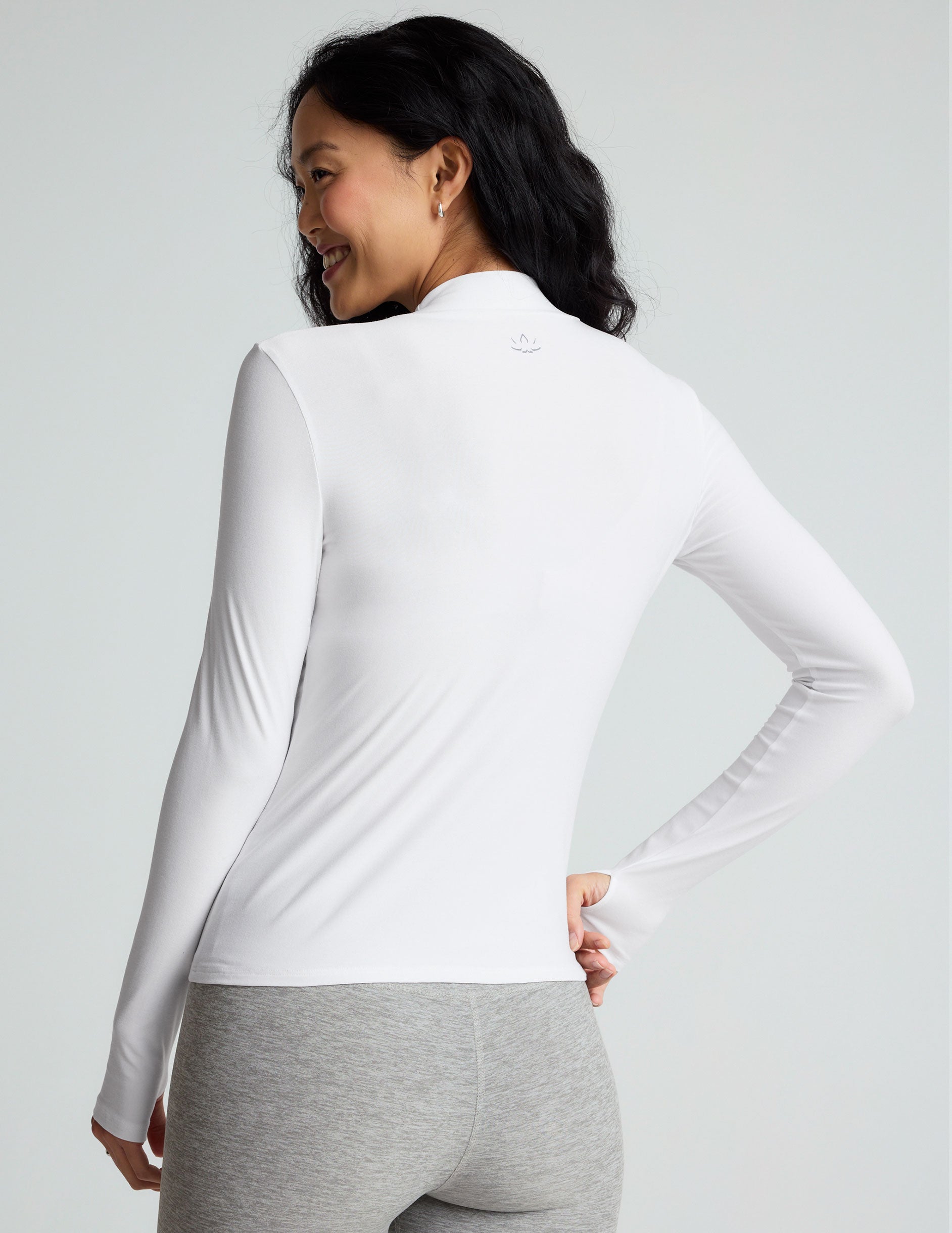 white mock neck long sleeve top.