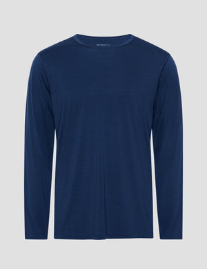 blue long-sleeve shirt against a gray background. 