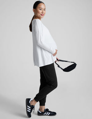 white long sleeve crew neck maternity top. 