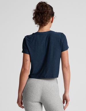 blue short sleeve cropped t-shirt with a scooped neckline. 
