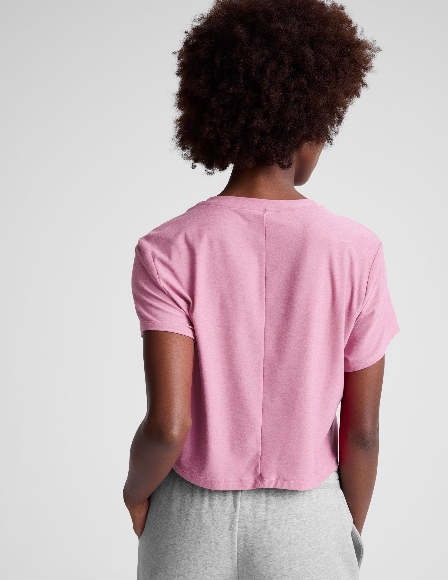 pink cropped short sleeve tee with a scoop neck. 