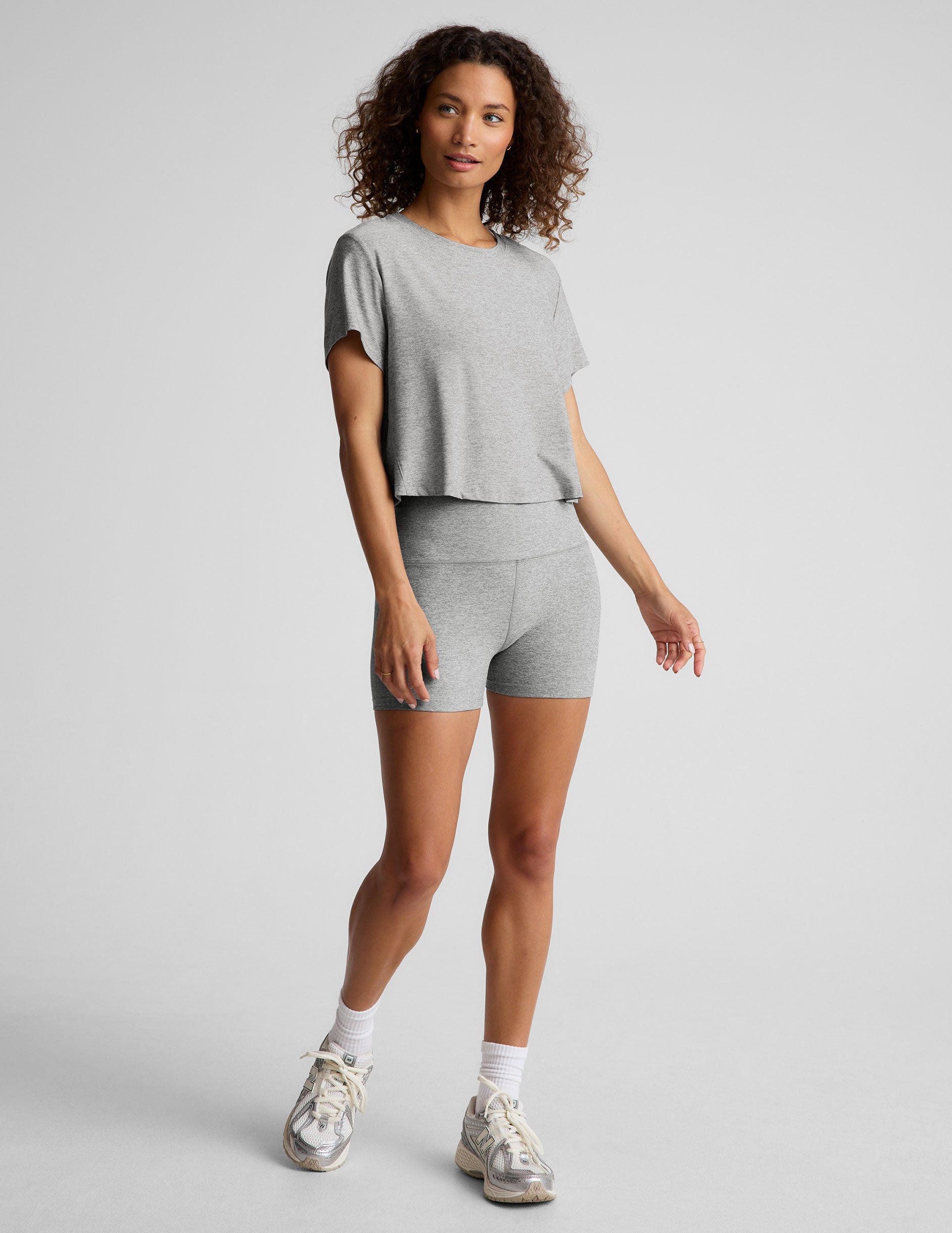 gray short sleeve loose-fitting cropped tee with a scoop neckline. 