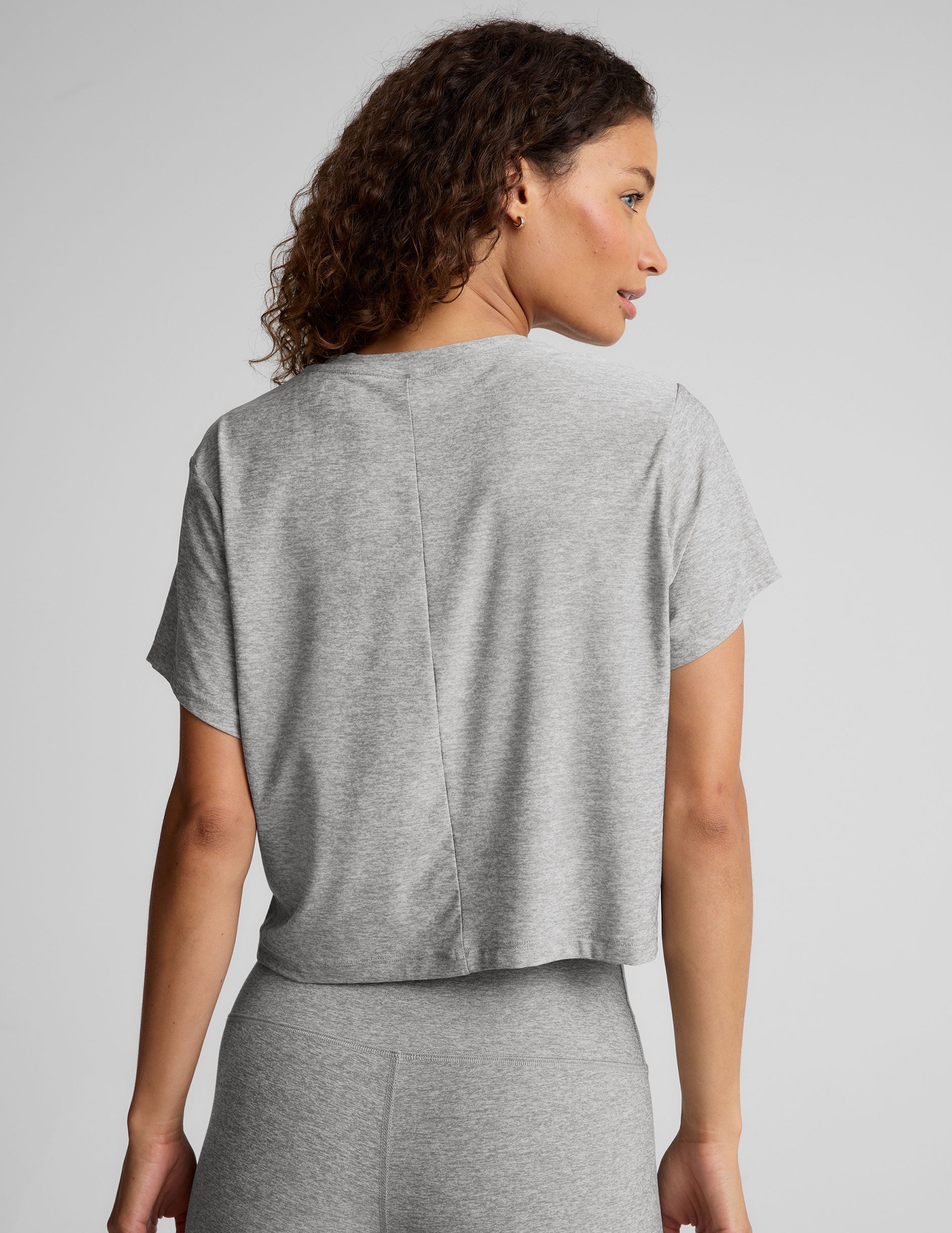 gray short sleeve loose-fitting cropped tee with a scoop neckline. 