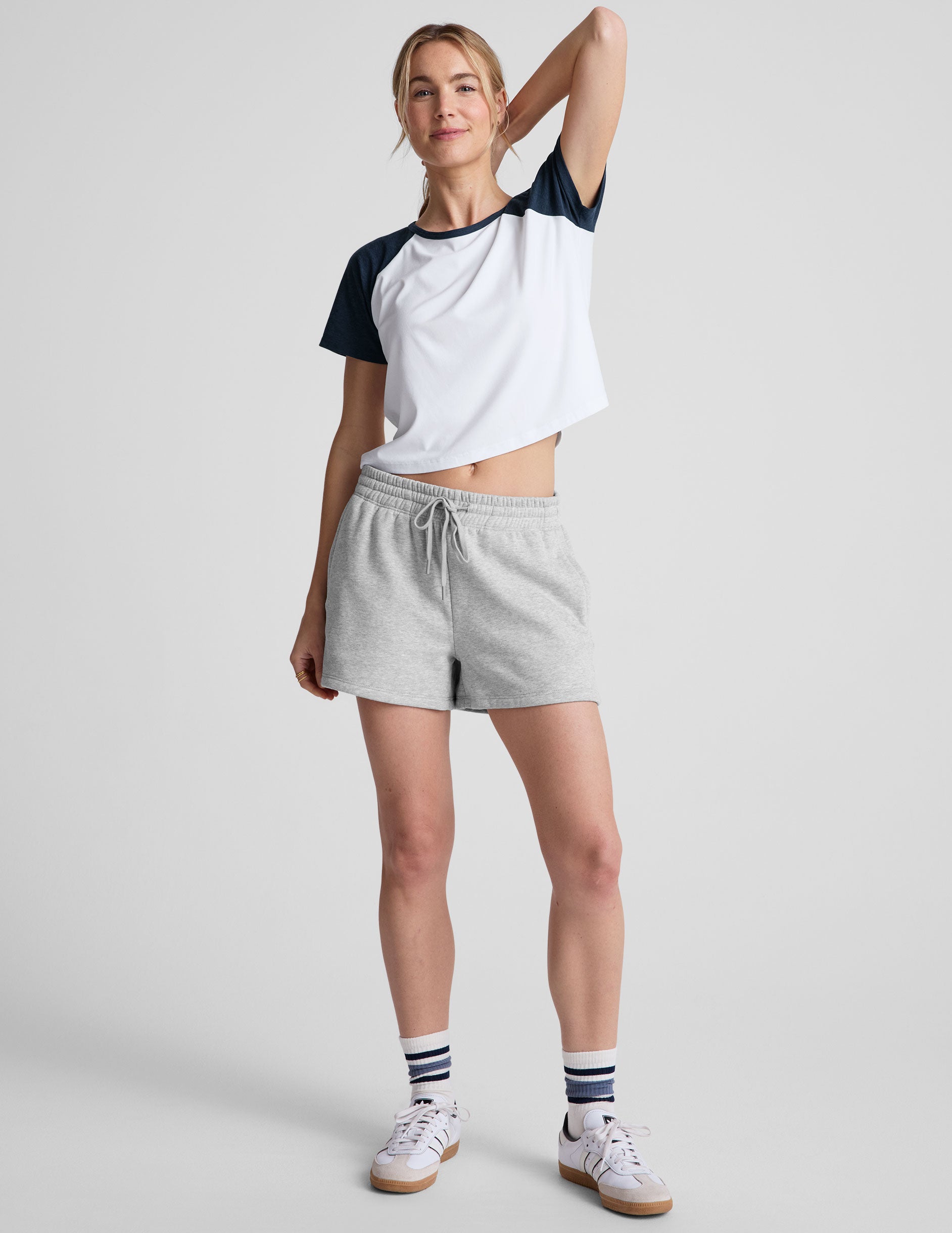 white relaxed fit, waist length t-shirt with colorblock raglan sleeve and neck binding. 