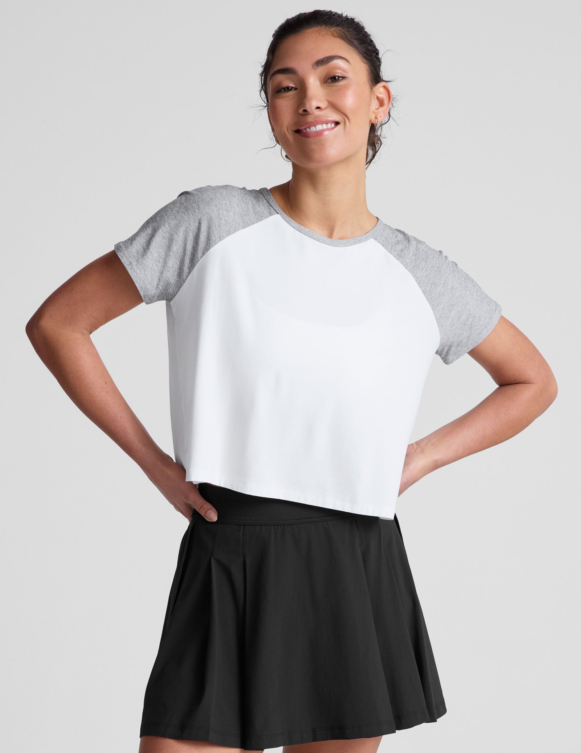 white relaxed fit t-shirt with colorblock raglan sleeve and neck binding​.