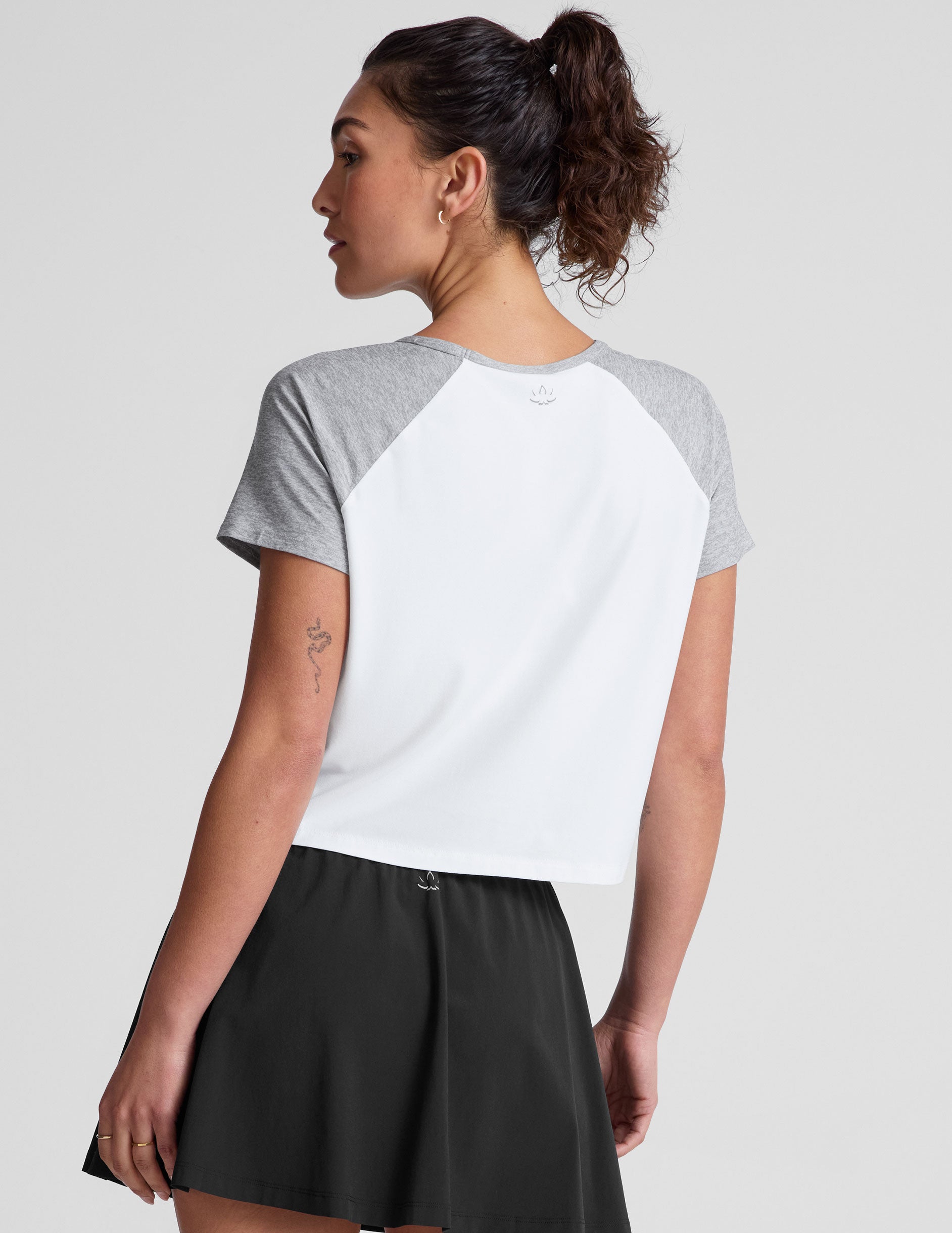 white relaxed fit t-shirt with colorblock raglan sleeve and neck binding​.