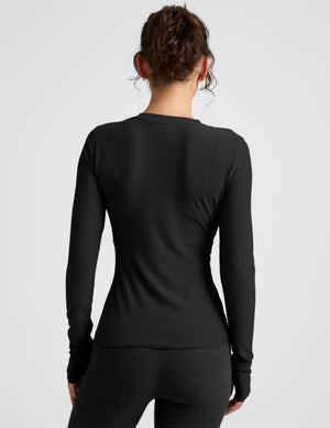 black crew neck long sleeve with thumb holes. 