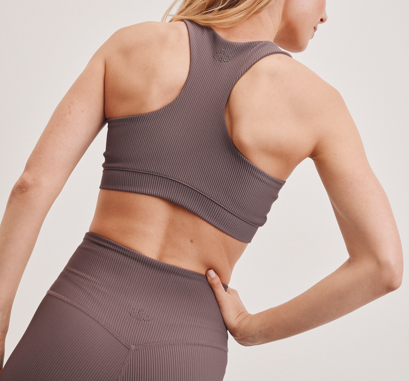 model is wearing a brown ribbed racerback bra. 