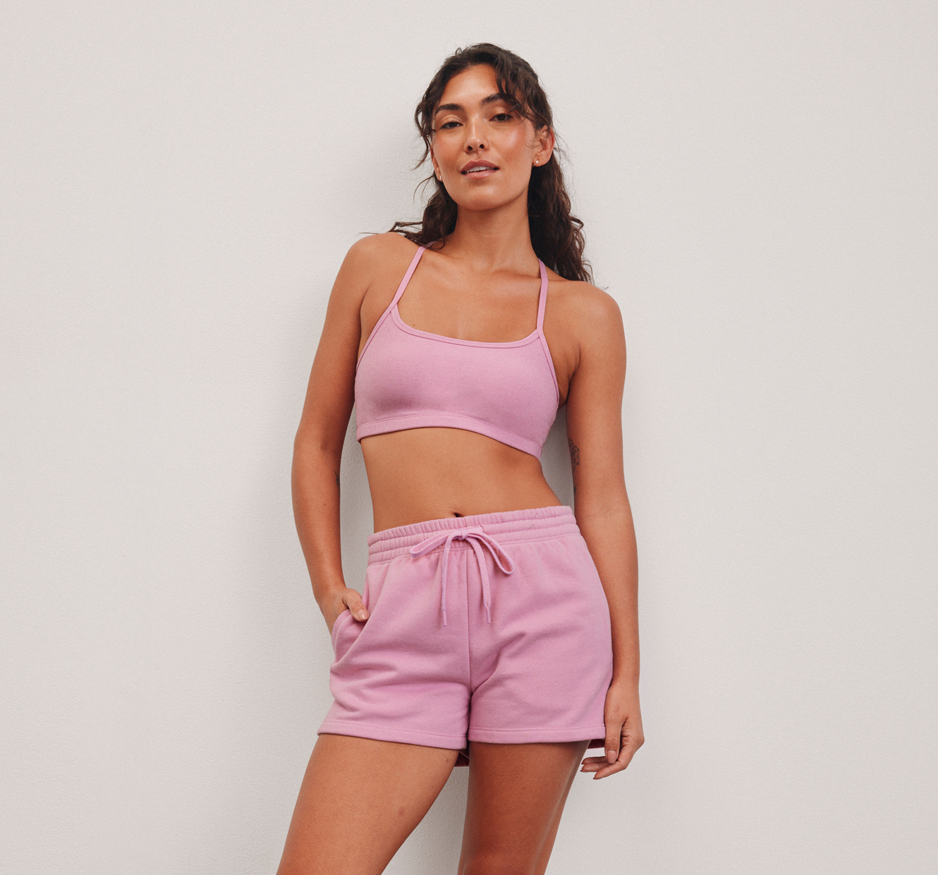 pink bra top and pink fleece shorts. 