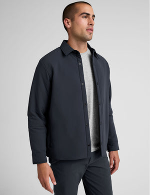 blue men's button up insulated jacket with a shirt collar and side seam invisible zipper pockets. 