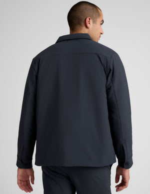 blue men's button up insulated jacket with a shirt collar and side seam invisible zipper pockets. 