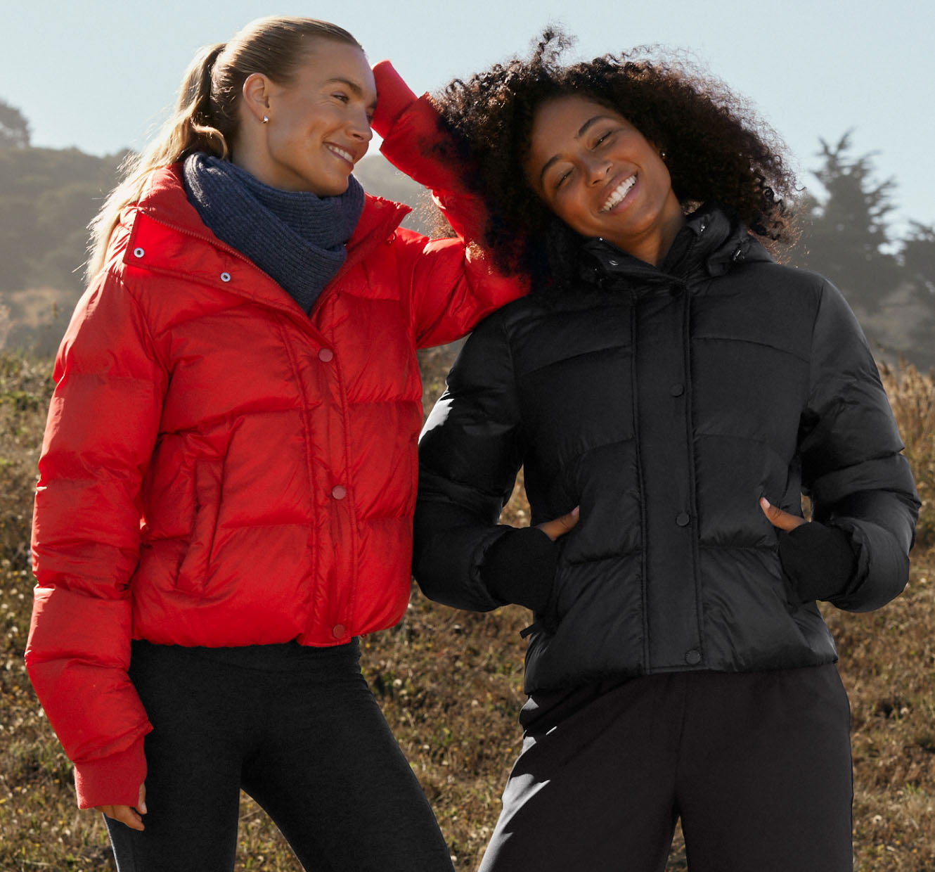 red zip-up and button up puffer jacket and black zip-up and button-up puffer jacket. 