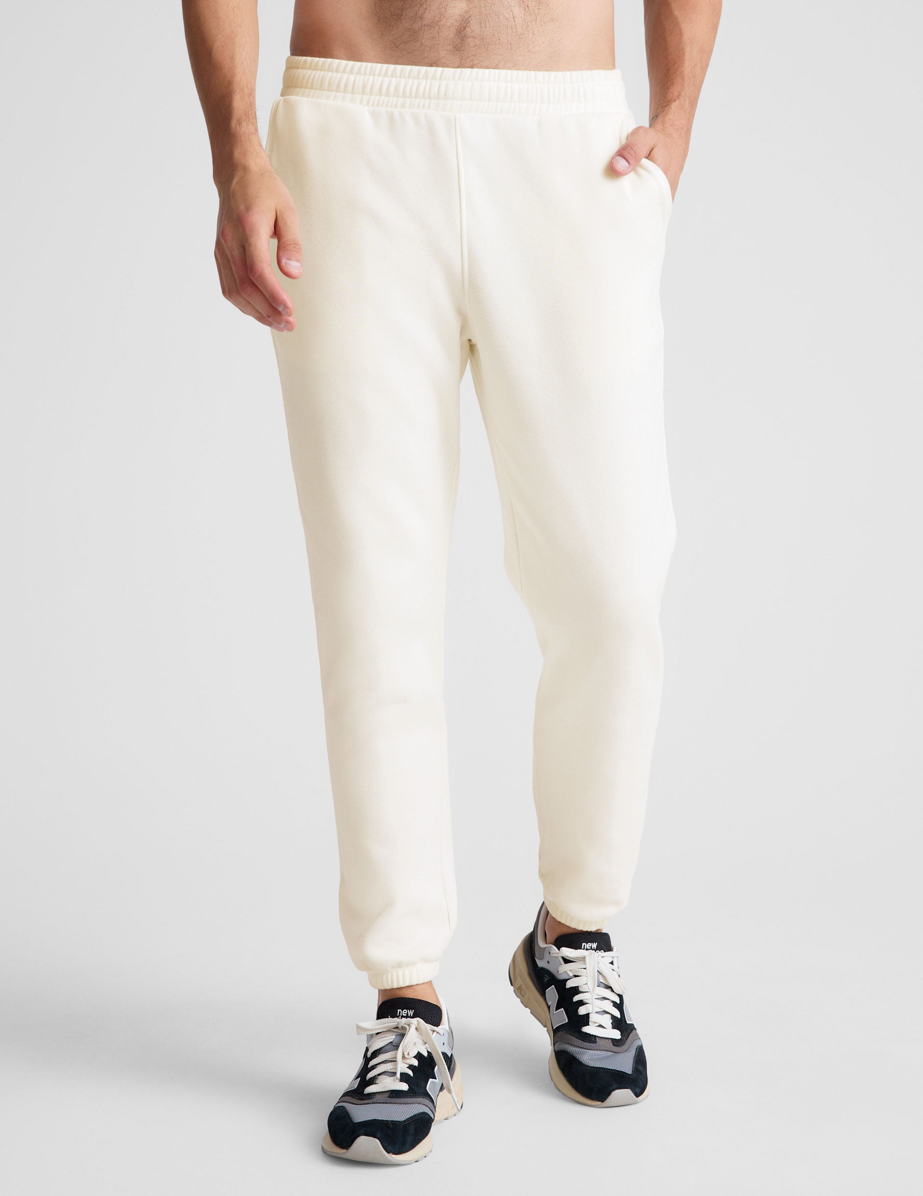 white men's sweatpants with a drawstring at waistband.