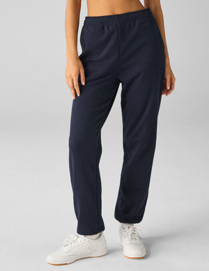 blue jogger style sweatpants with pockets. 