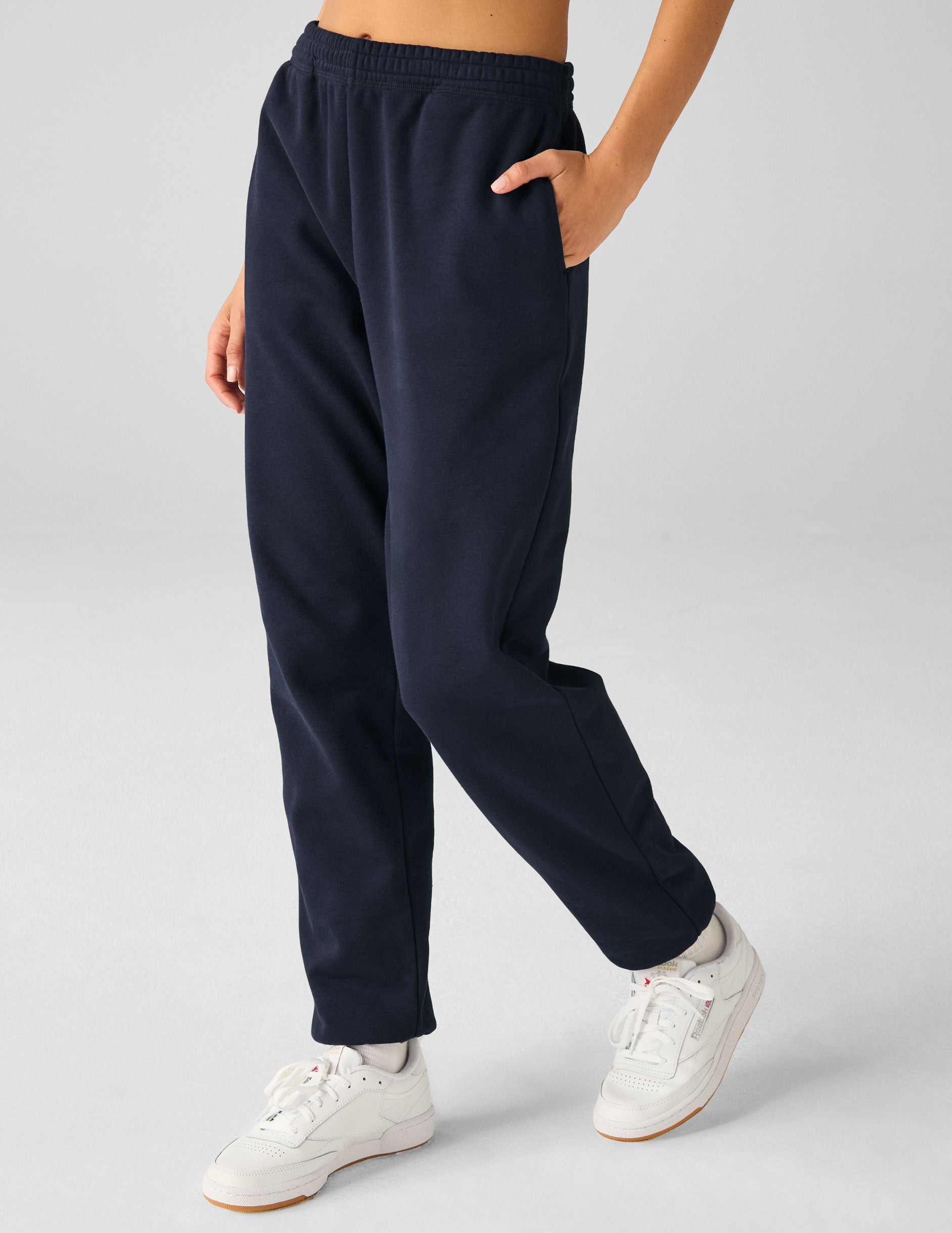 blue jogger style sweatpants with pockets. 