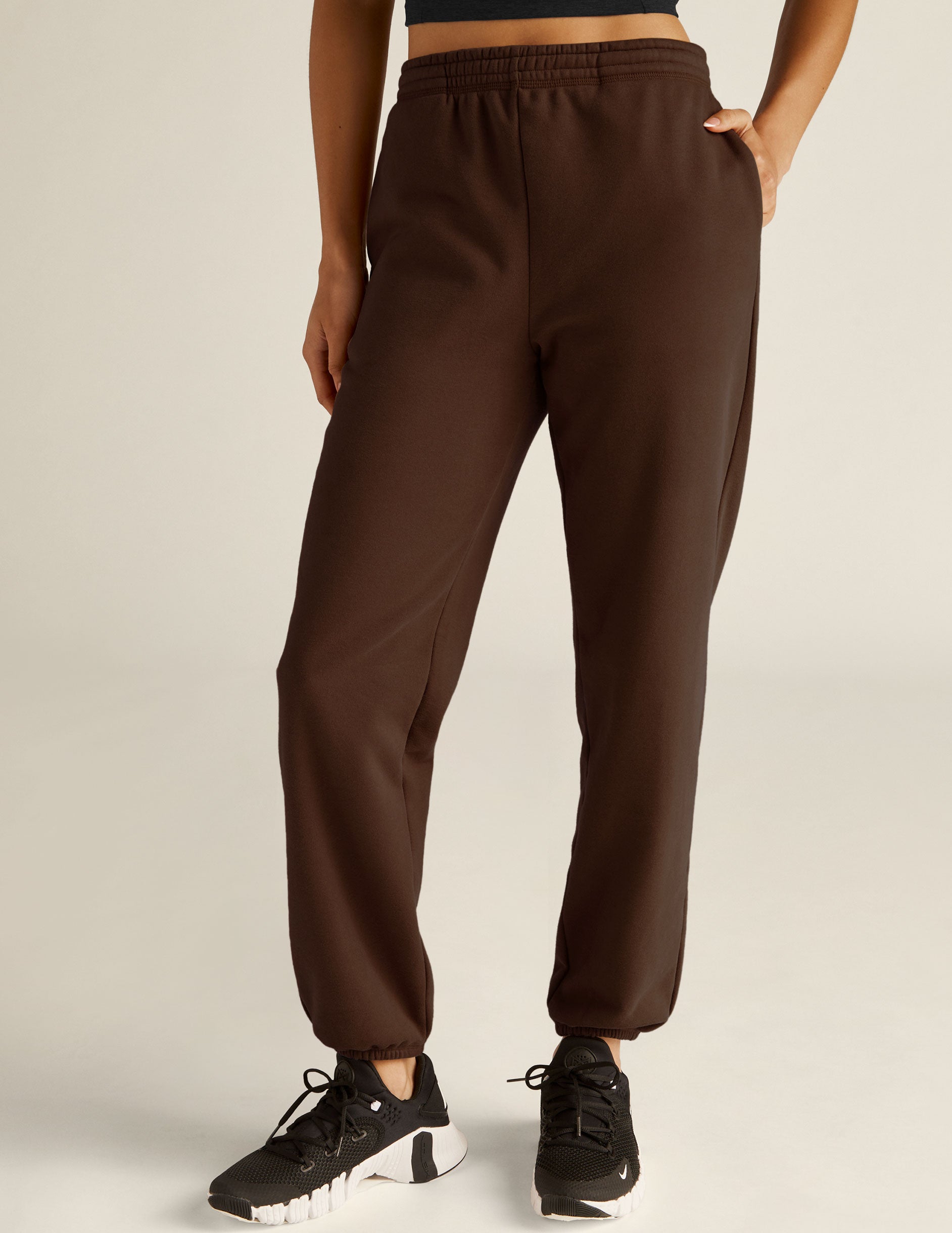 brown jogger style sweatpants with pockets. 