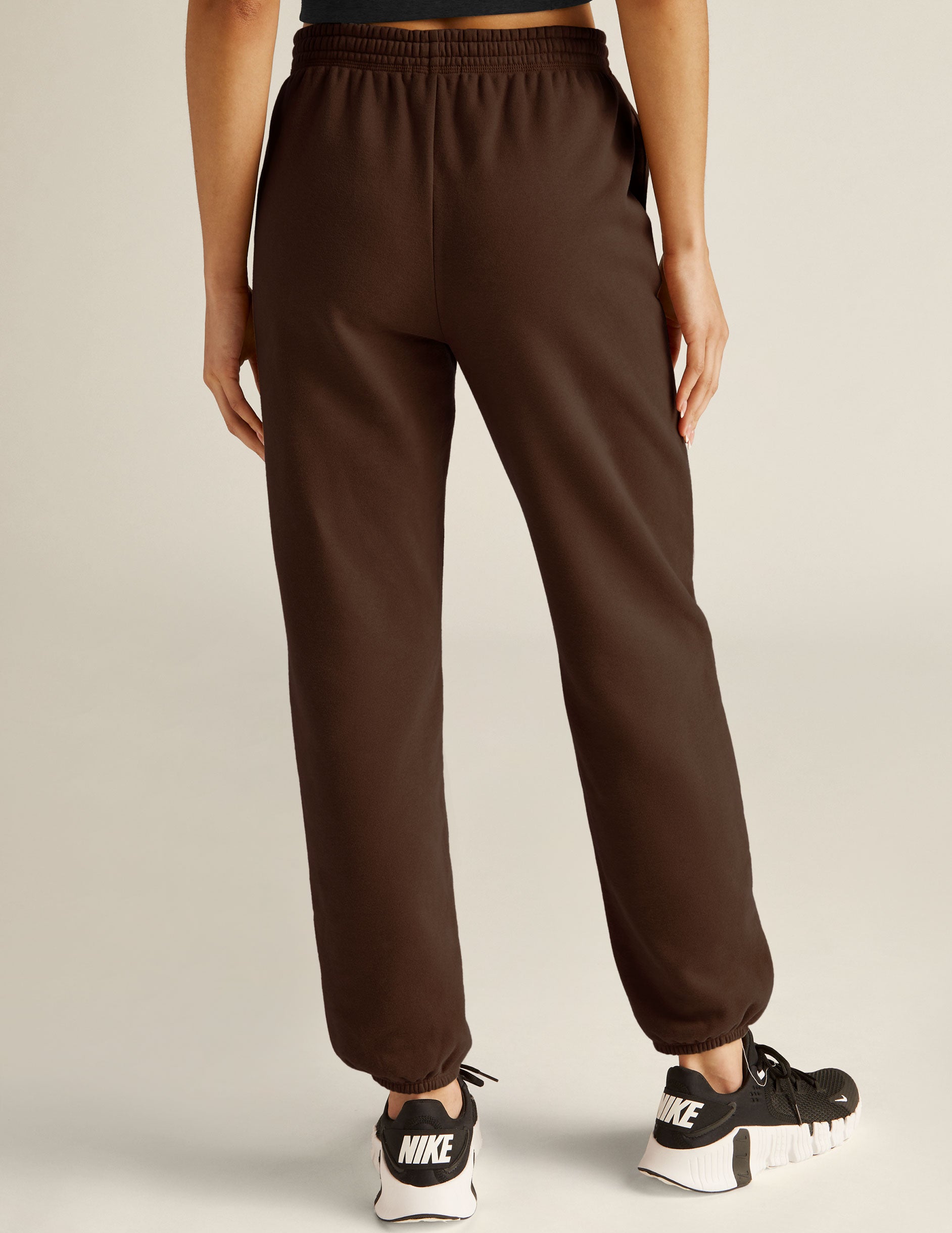 brown jogger style sweatpants with pockets. 