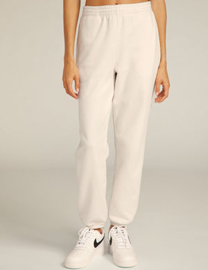 Front view of the cream On the Go Jogger, featuring a relaxed fit with elastic waistband and gathered ankle cuffs.