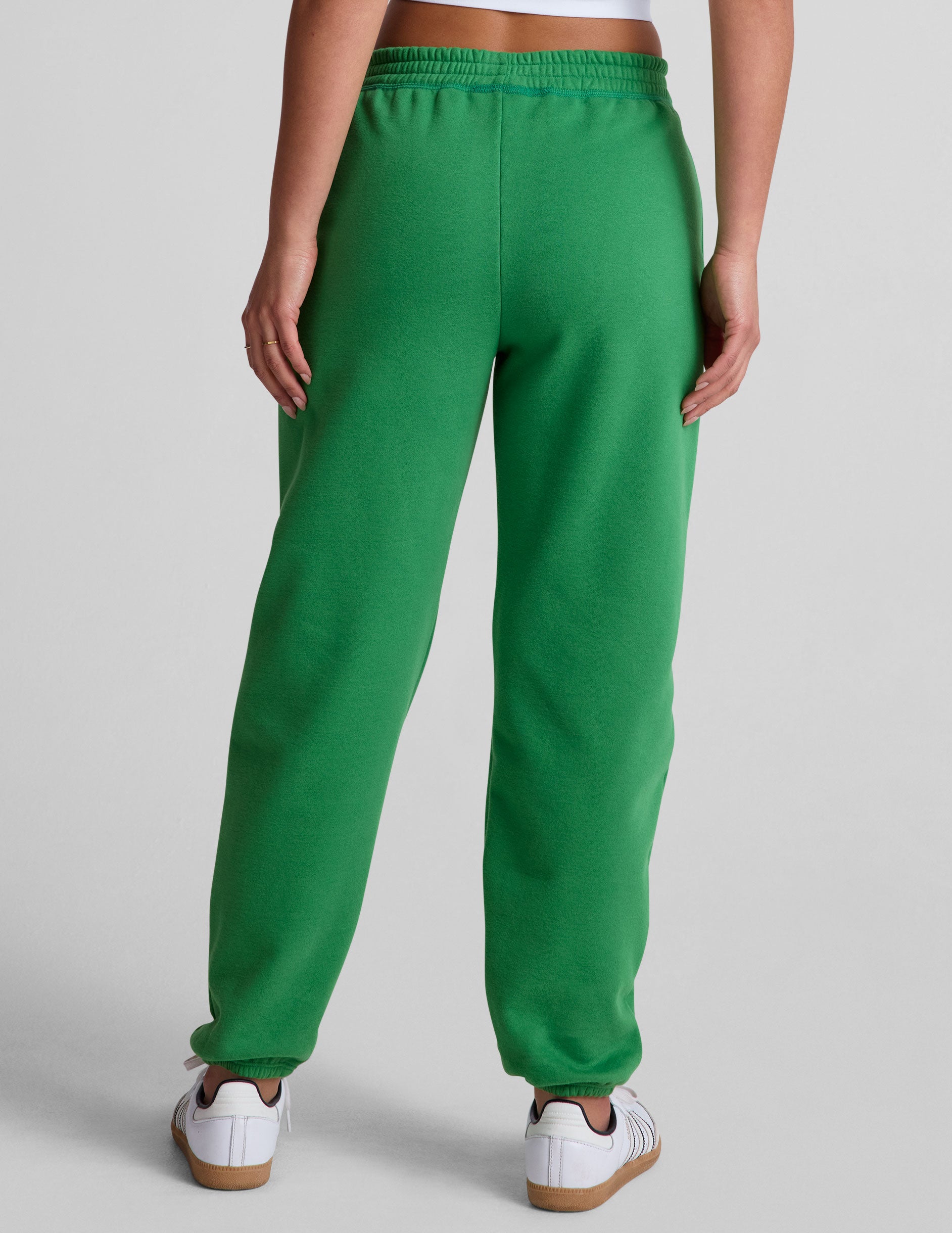 green midi length joggers with pockets. 