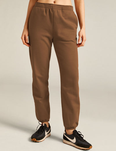 brown midi length joggers with elasticated waistband with internal drawcord and pockets on seam. 