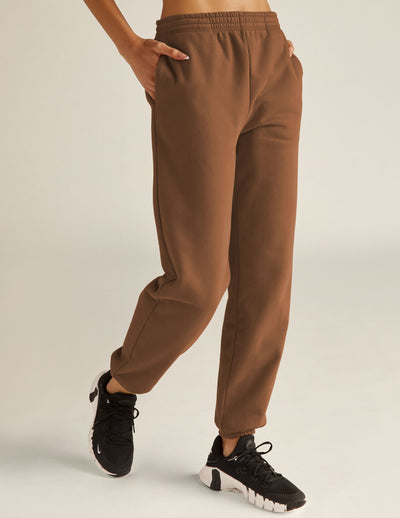 brown midi length joggers with elasticated waistband with internal drawcord and pockets on seam. 