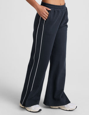 blue sweatpant with a mid rise elasticated waistband and contrast piping trim down sides of leg. 