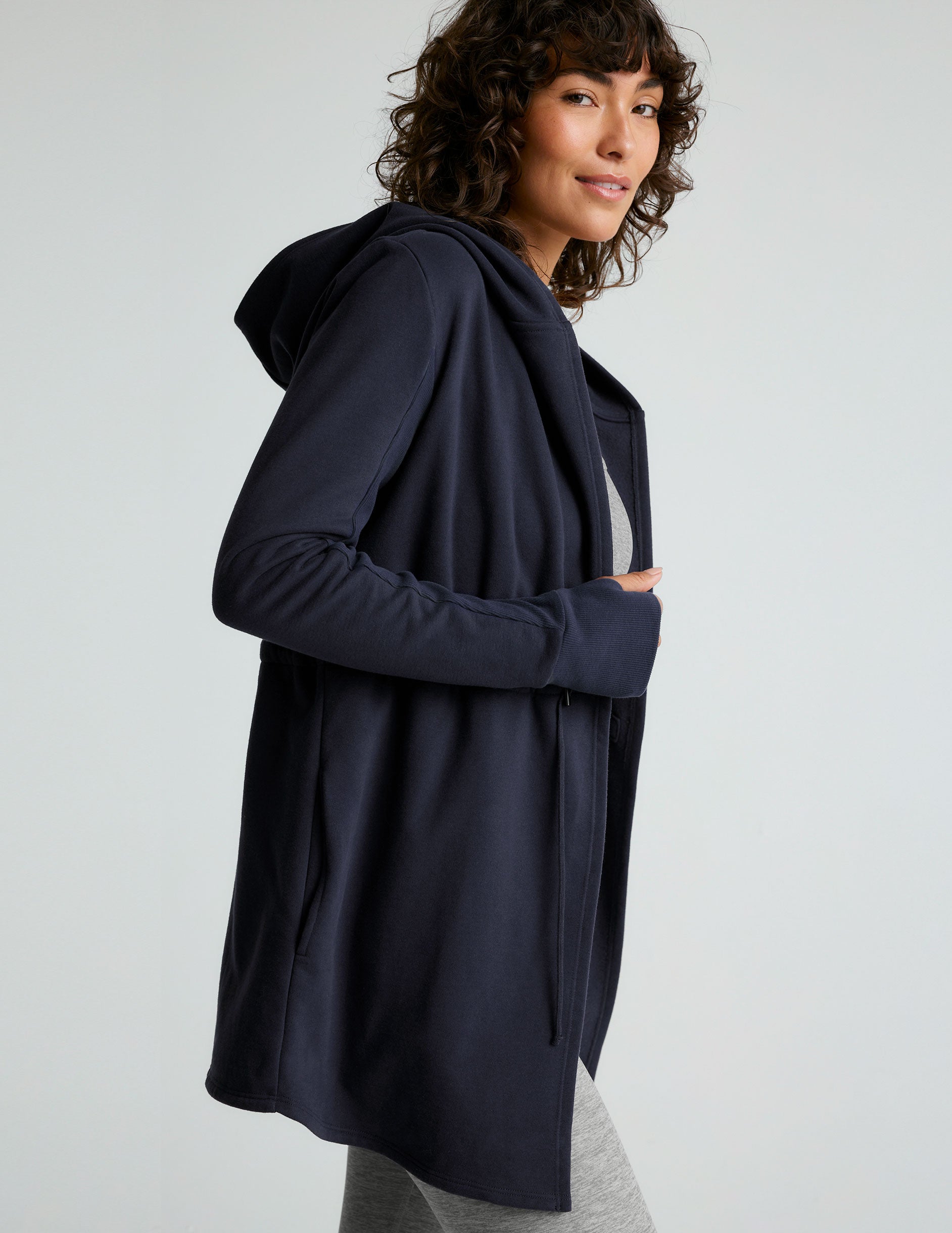 blue hooded long length jacket with pockets. 