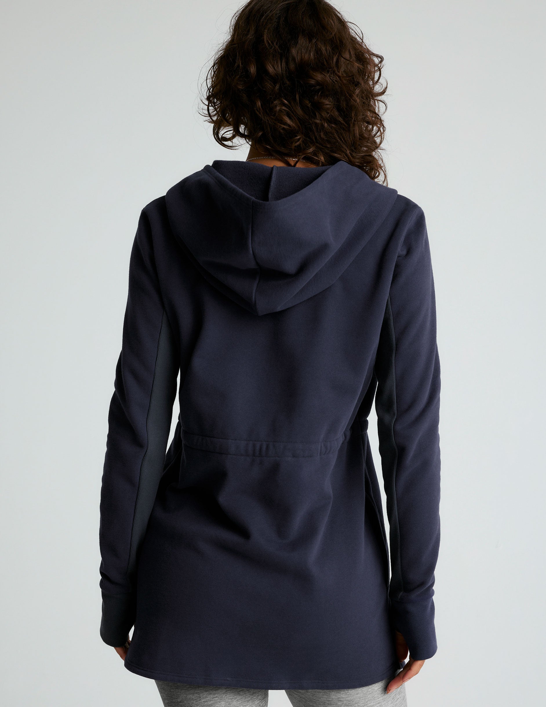 blue hooded long length jacket with pockets. 