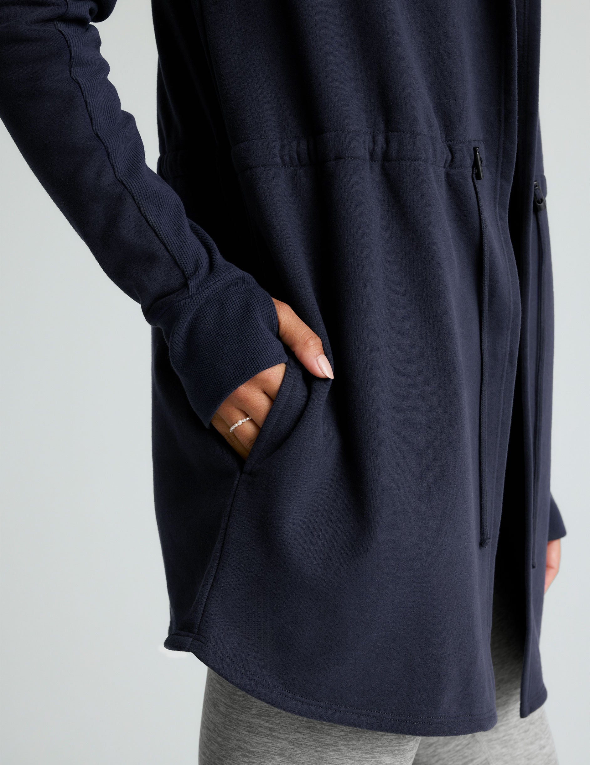 blue hooded long length jacket with pockets. 