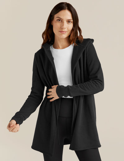 black jacket with a drawstring at the waist. 