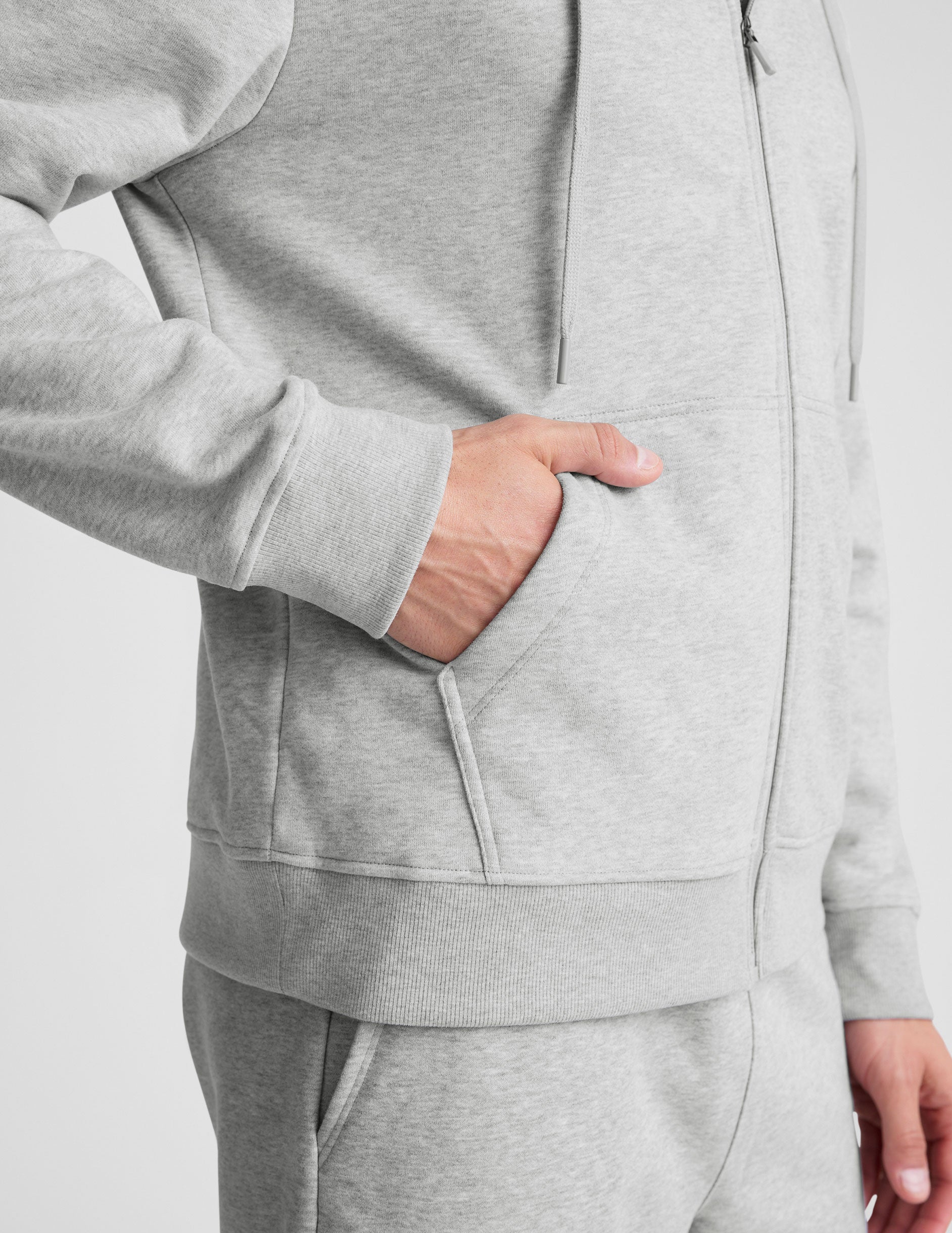 gray zip-up hooded jacket with pockets. 