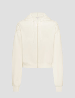 white fleece zip-up jacket on a plain background. 