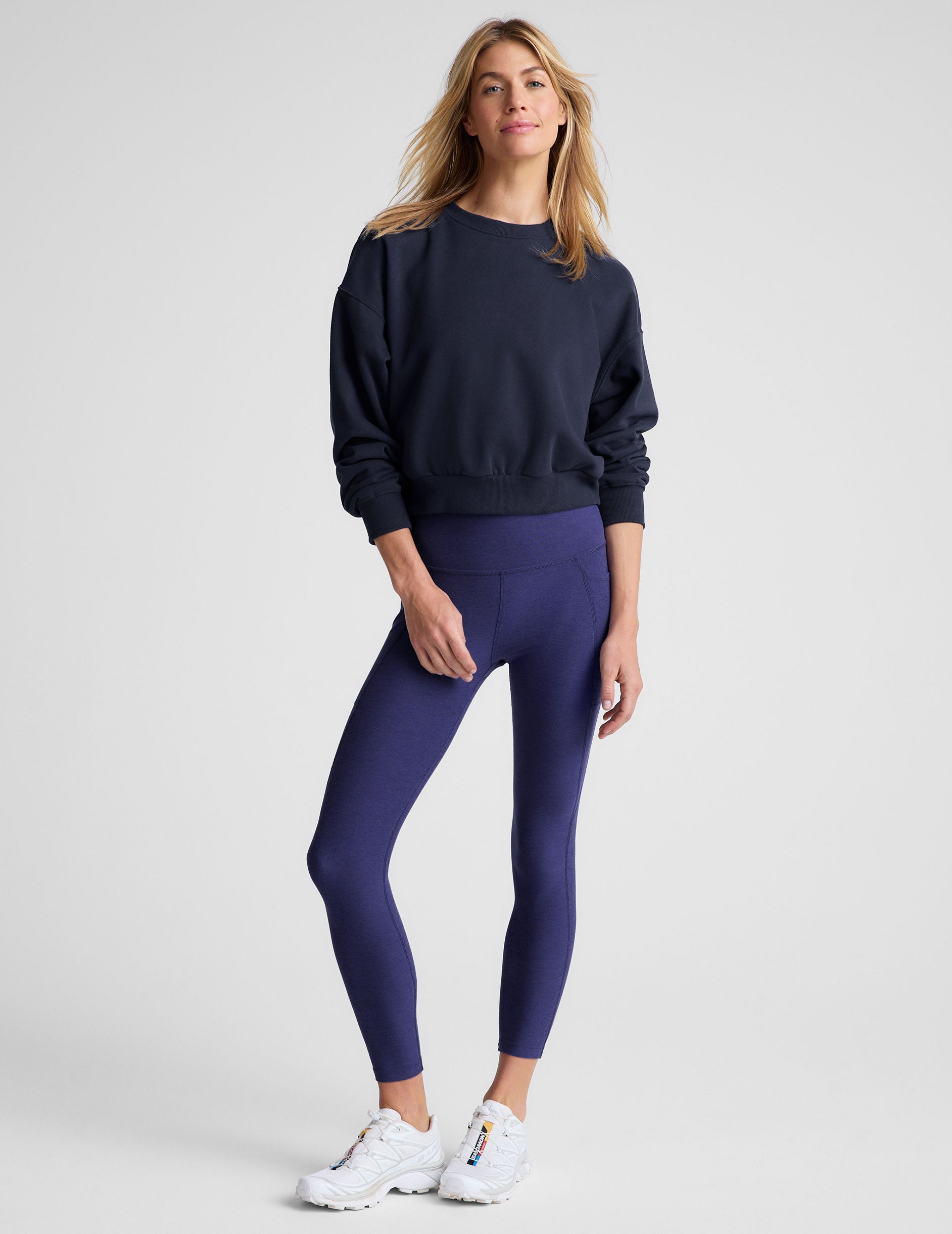 blue loose-fitting classic length crew neck sweatshirt. 