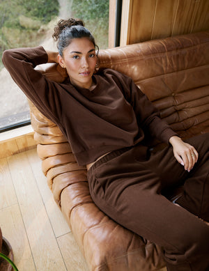 brown loose-fitting classic length crew neck sweatshirt. 