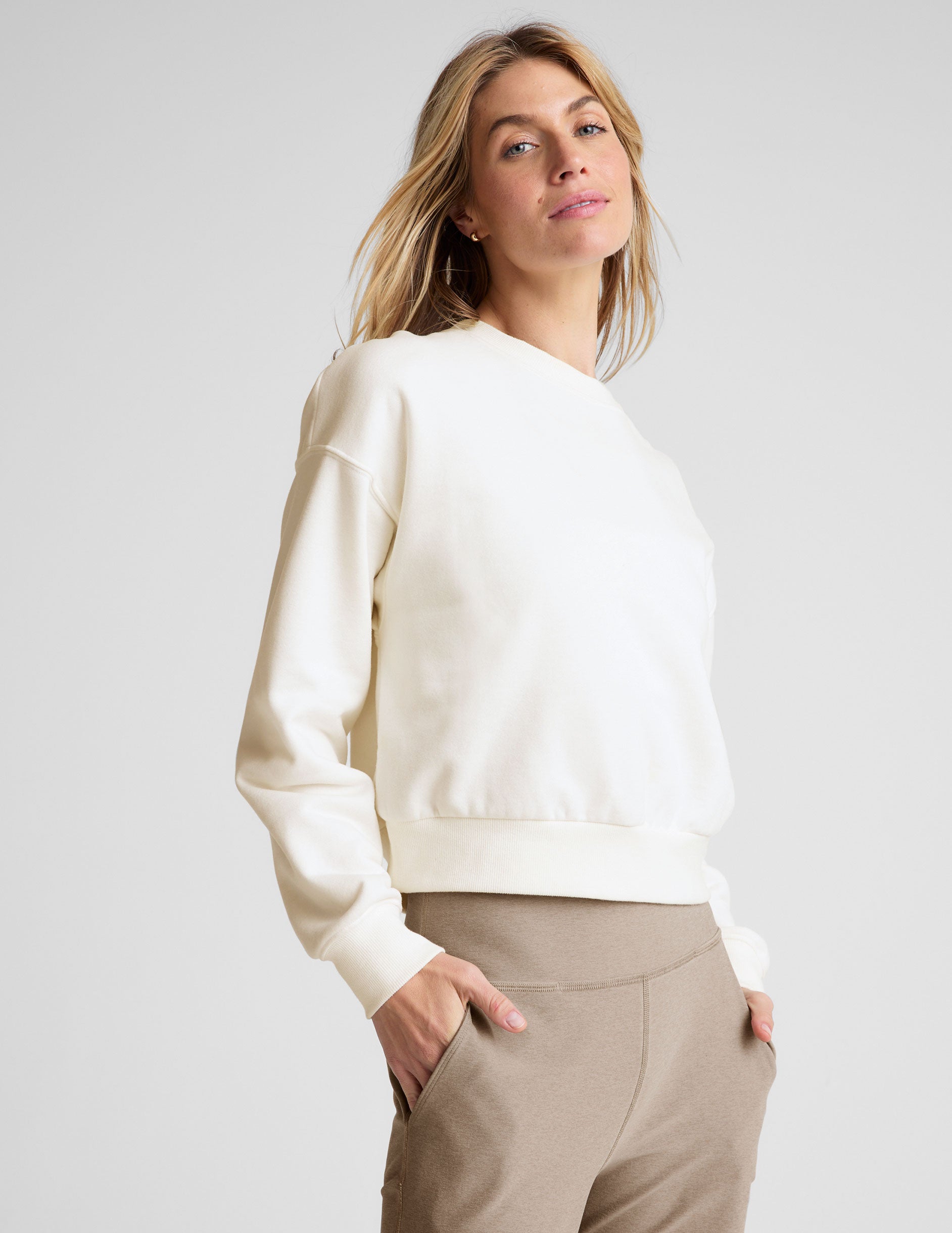 white loose-fitting classic length crew neck sweatshirt. 