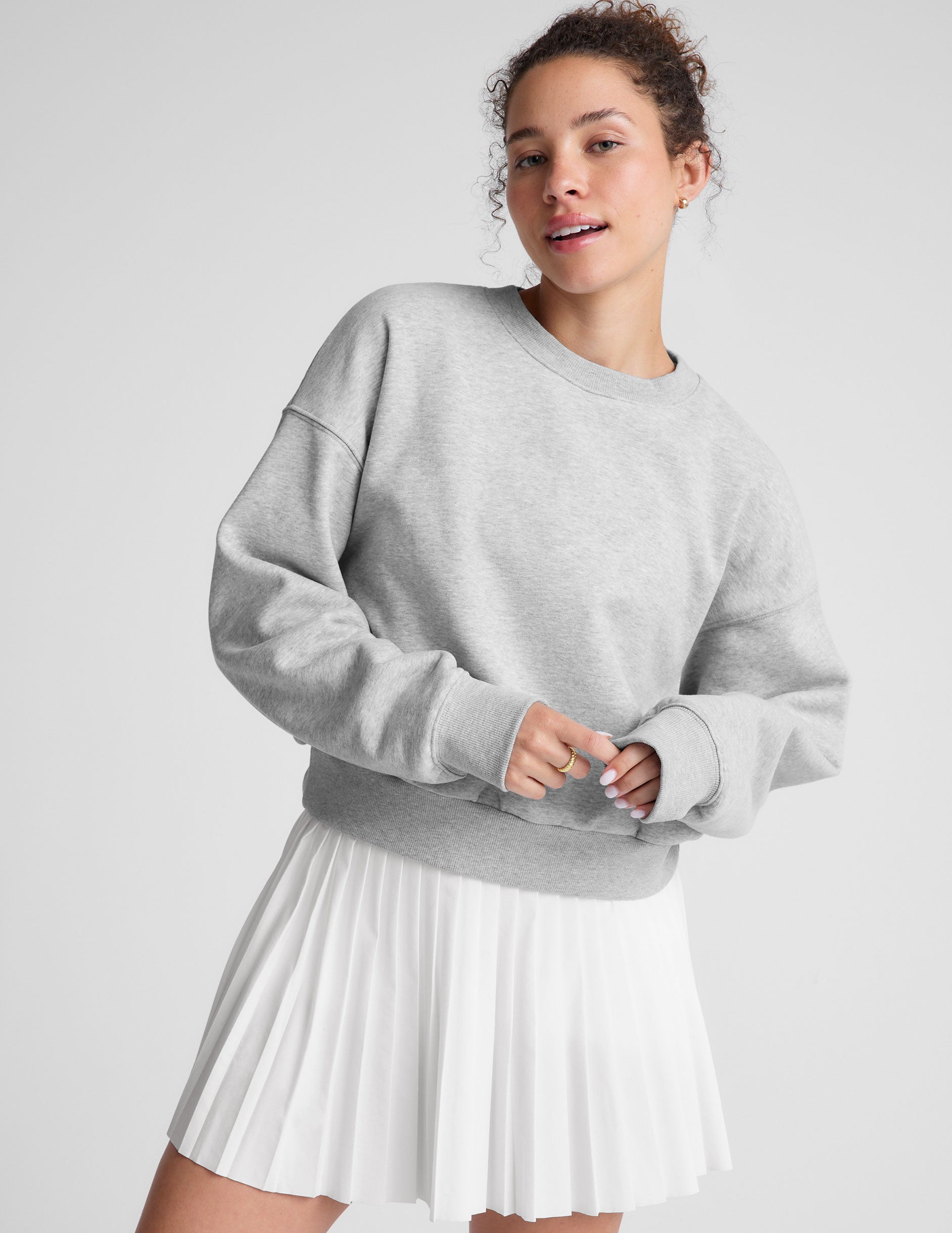 gray loose-fitting classic length crew neck sweatshirt. 