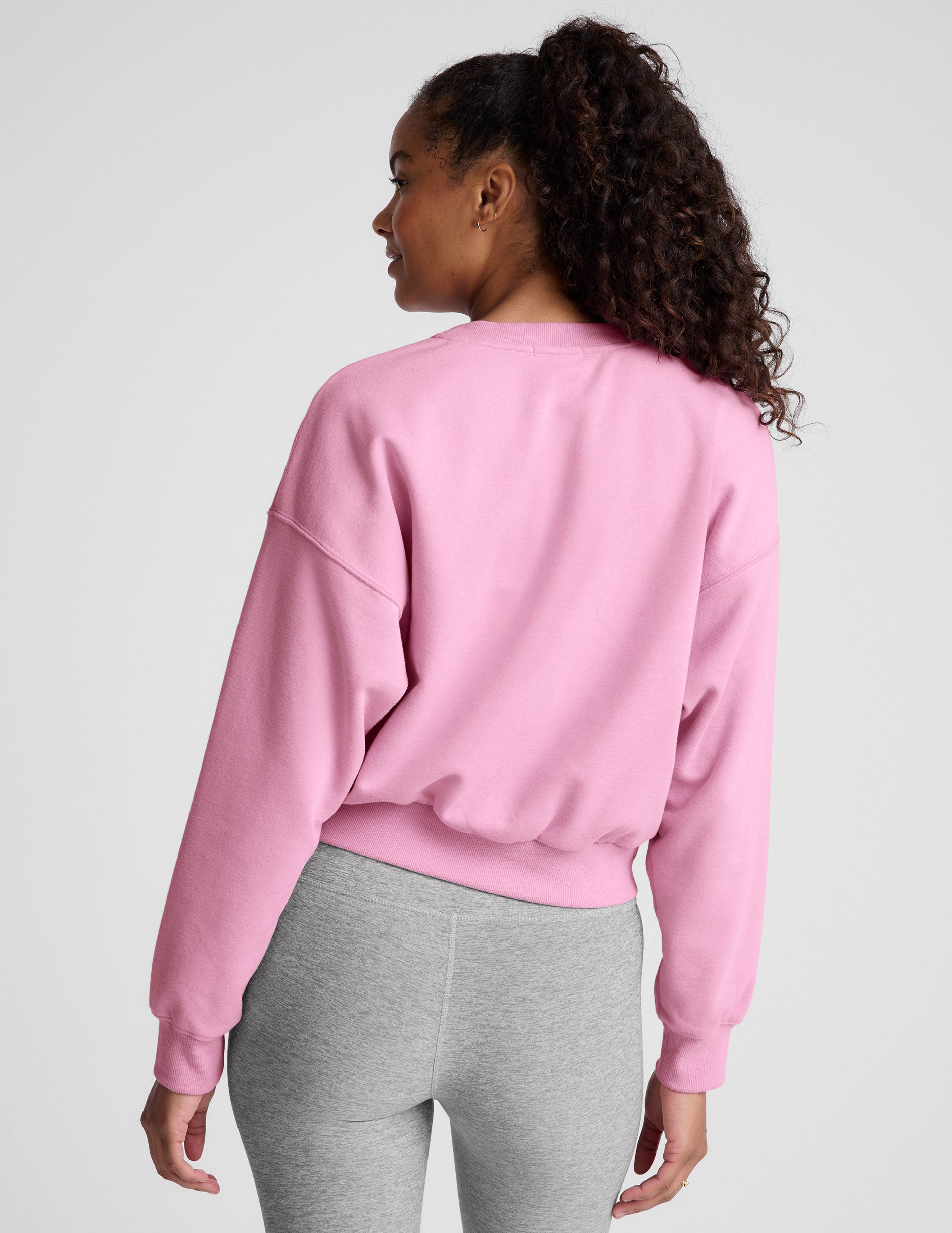 pink crew neck loose-fitting classic length sweatshirt. 