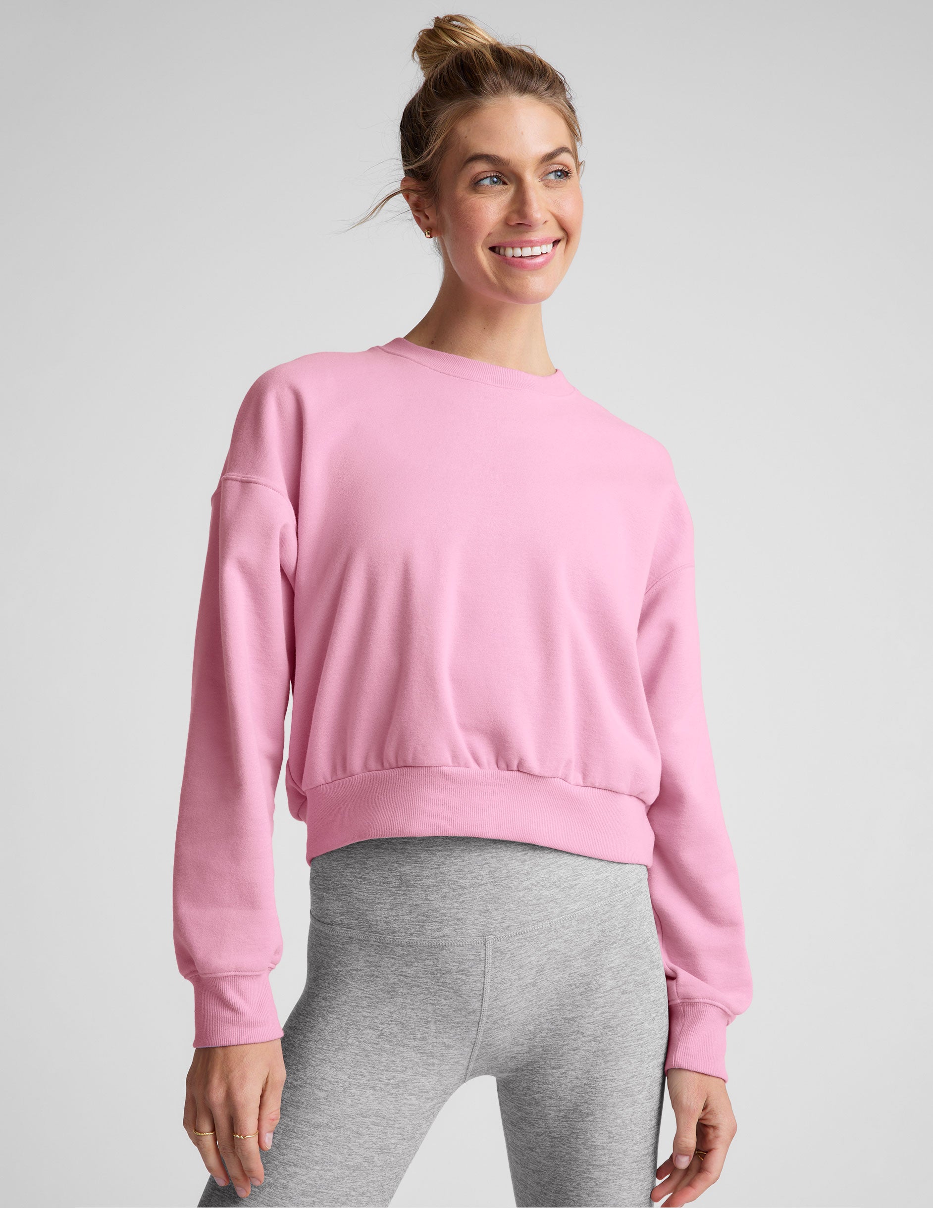 pink crew neck loose-fitting classic length sweatshirt. 