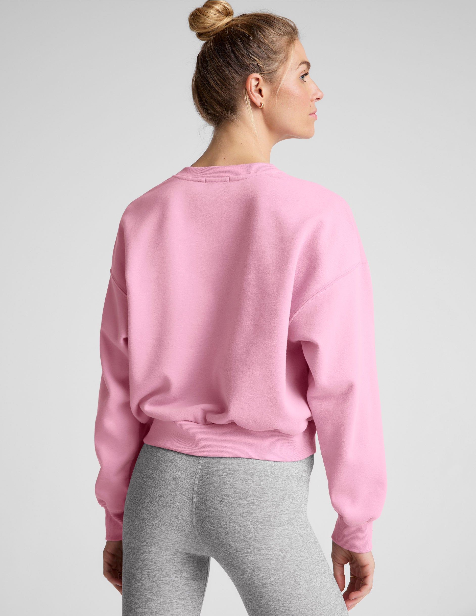 pink crew neck loose-fitting classic length sweatshirt. 