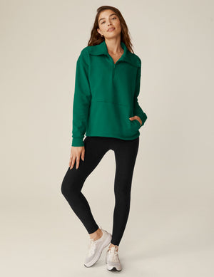 green quarter zip pullover jacket with a kangaroo pouch.