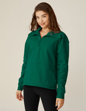 green quarter zip pullover jacket with a kangaroo pouch.