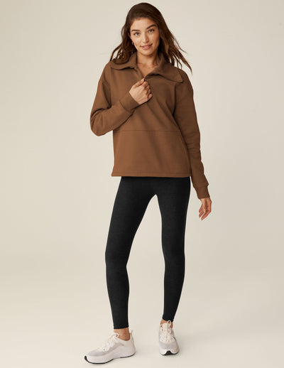 brown quarter zip pullover with kangaroo pocket. 