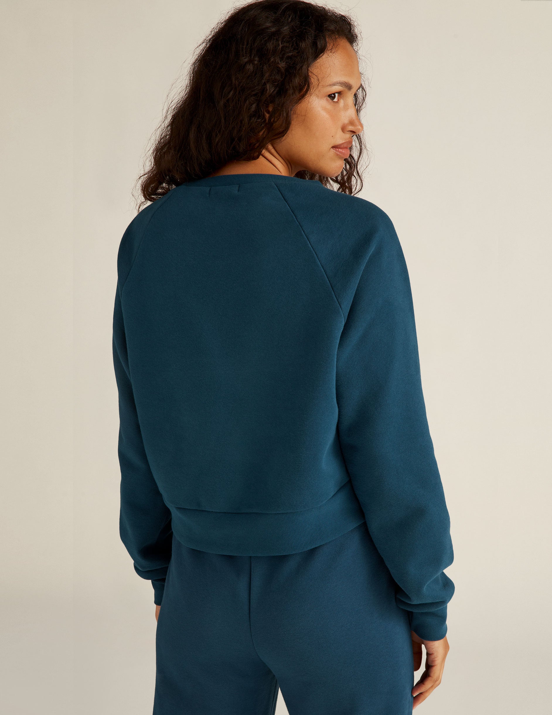 blue cropped long sleeve pullover. 