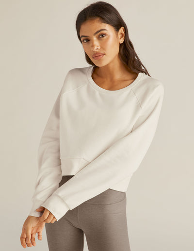 white cropped long sleeve pullover. 