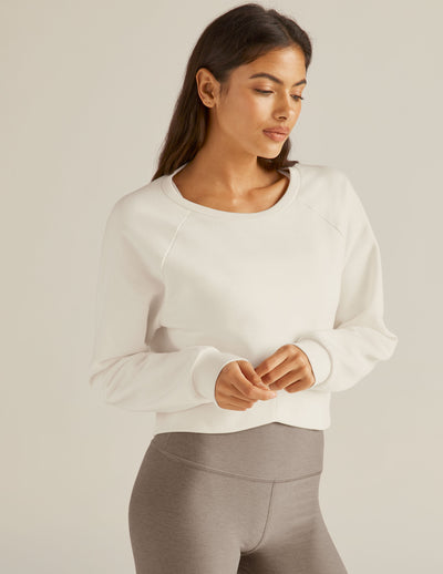 white cropped long sleeve pullover. 