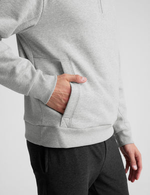 gray quarter zip jacket with kangaroo pocket. 