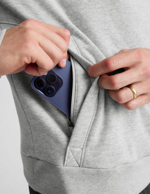gray quarter zip jacket with kangaroo pocket. 