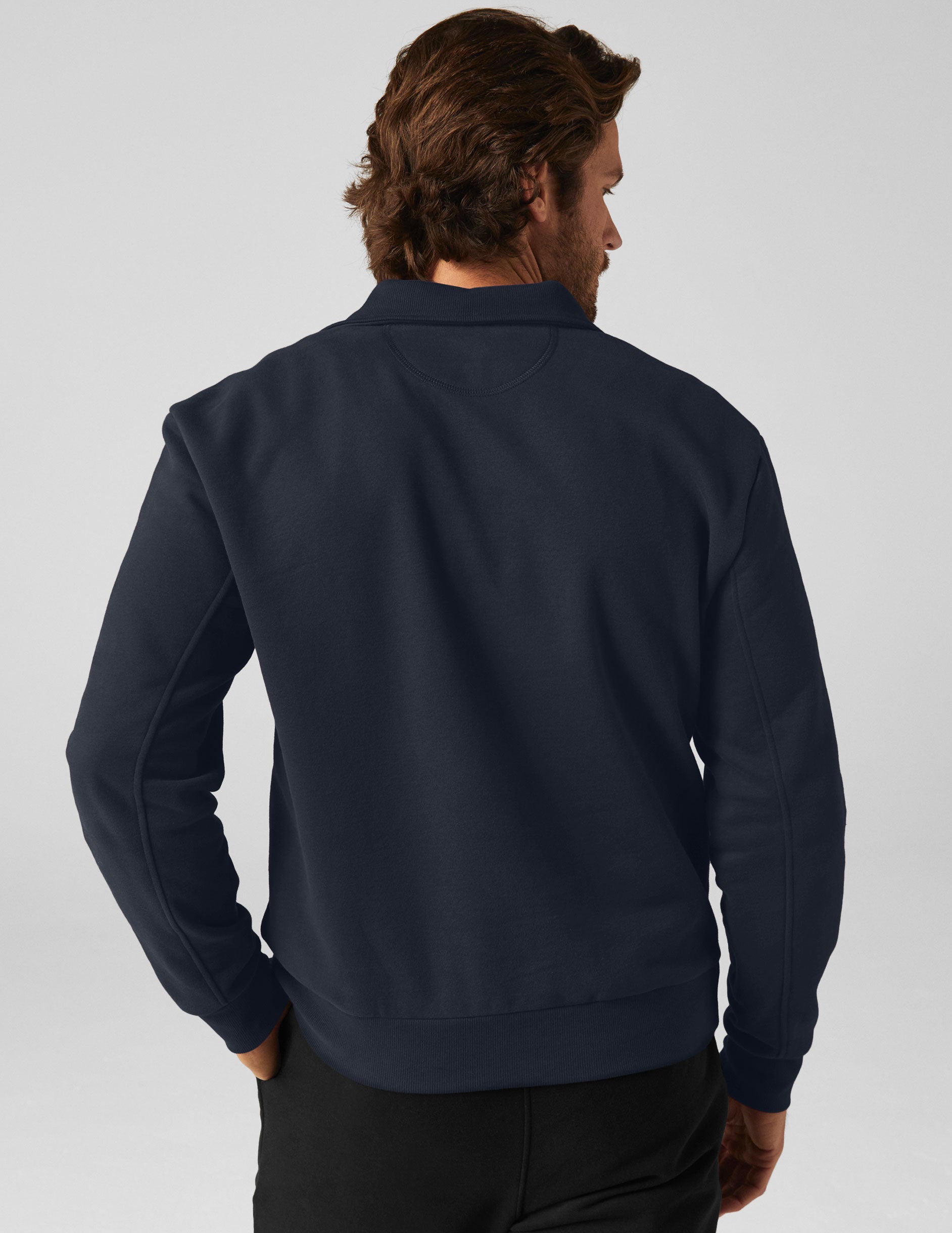 blue quarter zip men's pullover with a front pocket. 