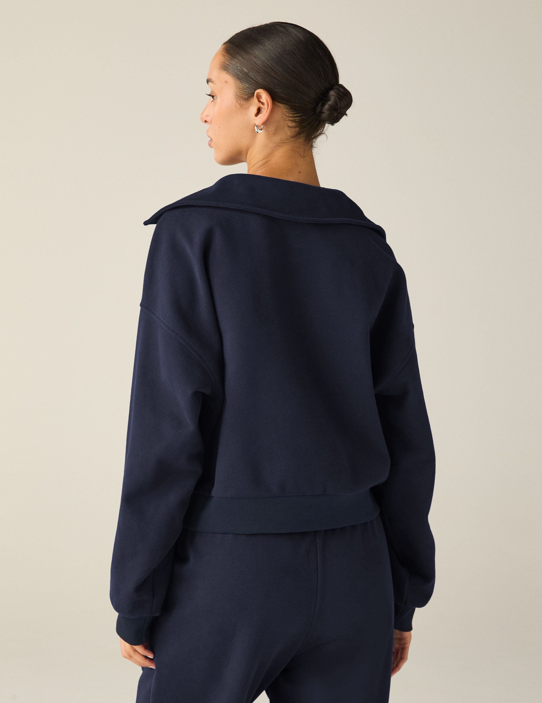 blue pullover sweater with a collar and kangaroo pocket. 