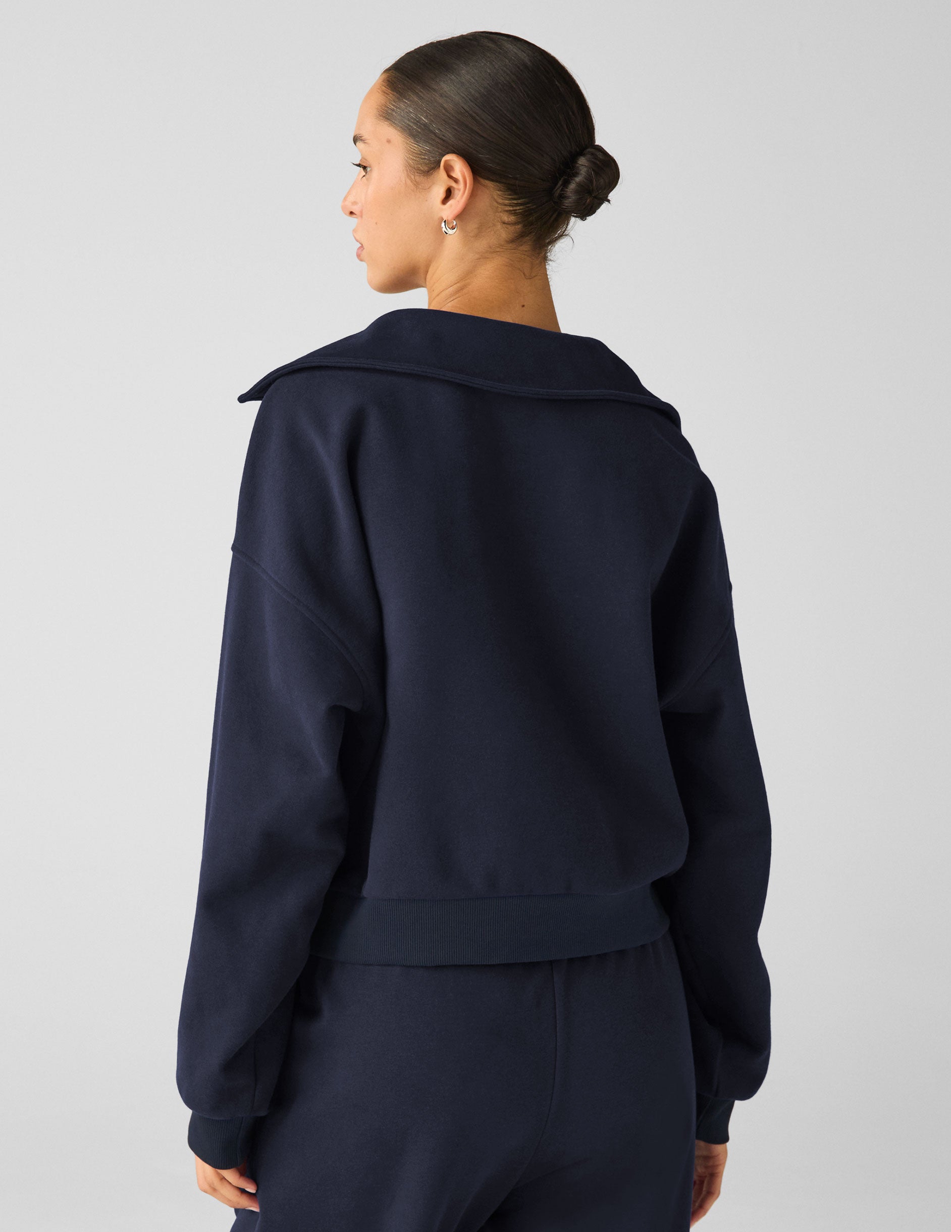 blue pullover sweater with a collar and kangaroo pocket. 